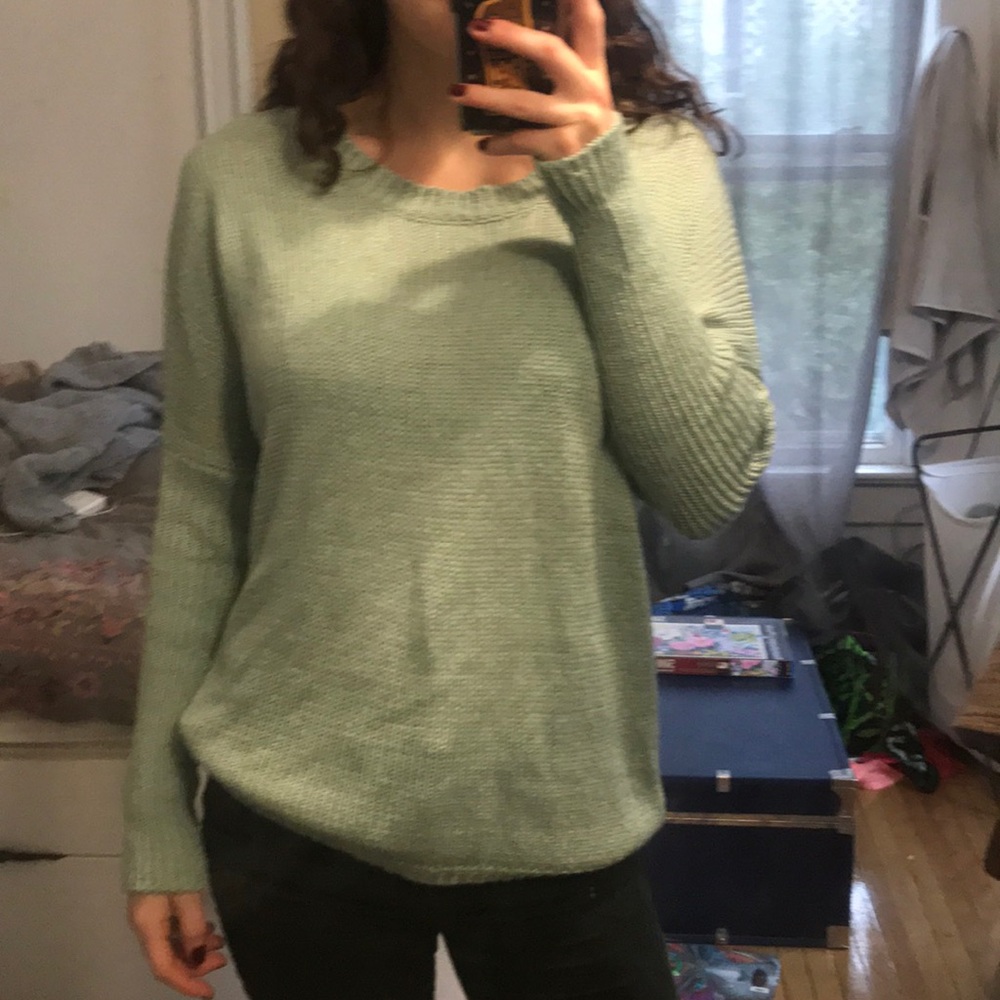 Blue sweater with rip down the back